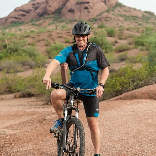 Dr. Dave Herzberg posing during an outdoor bike ride