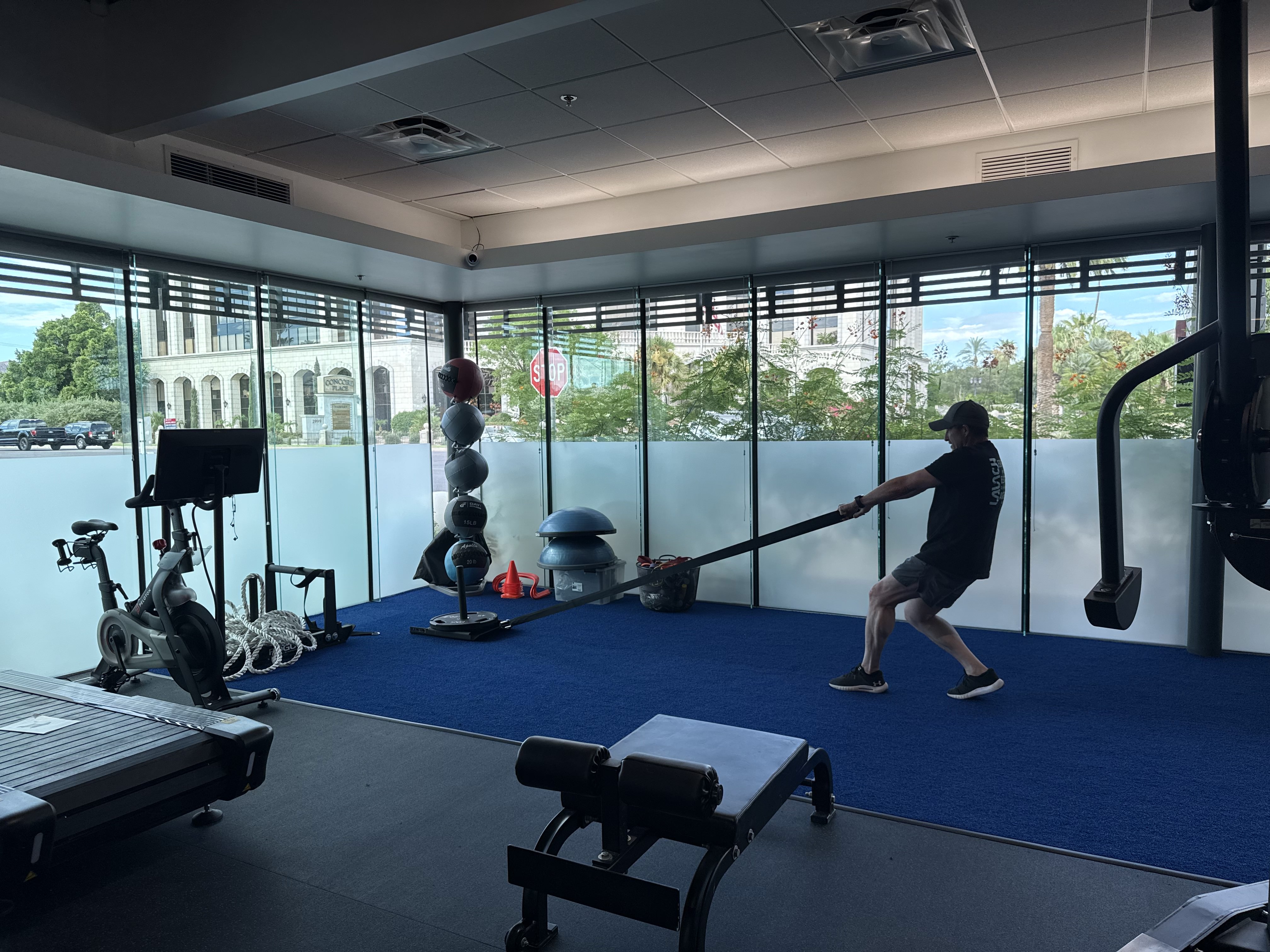 Man using battle ropes for rehabilitation treatment at Launch Physical Therapy